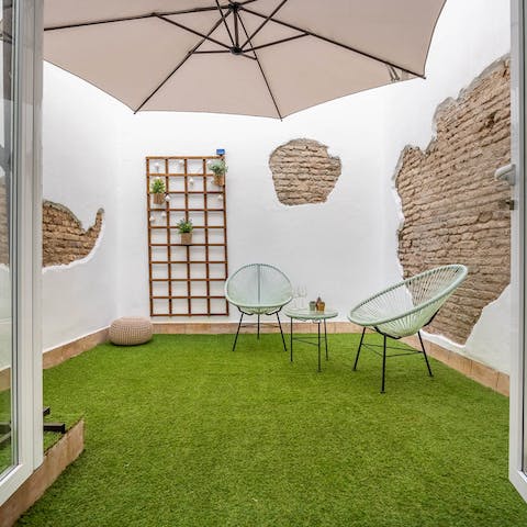 Step out of the bedroom onto a private outdoor area