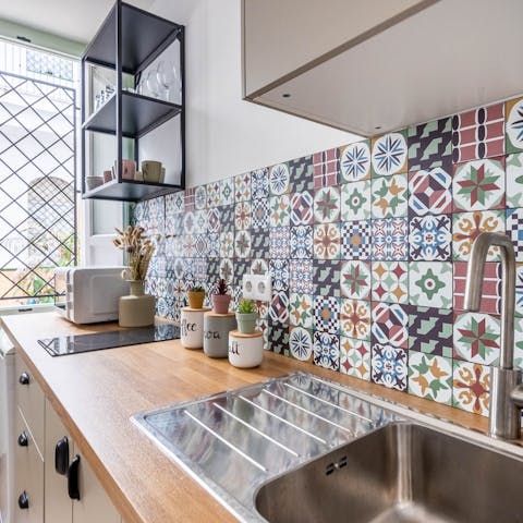 Rustle up home-cooked meals in the traditional kitchen with colourful azulejo tiles