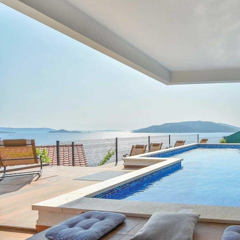 Soak up coastal views from the sun-drenched pool and terrace