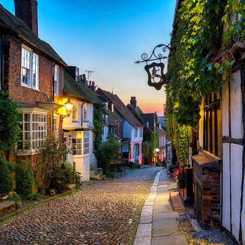 Explore Rye's charming cobbled streets, a short ten-minute drive away