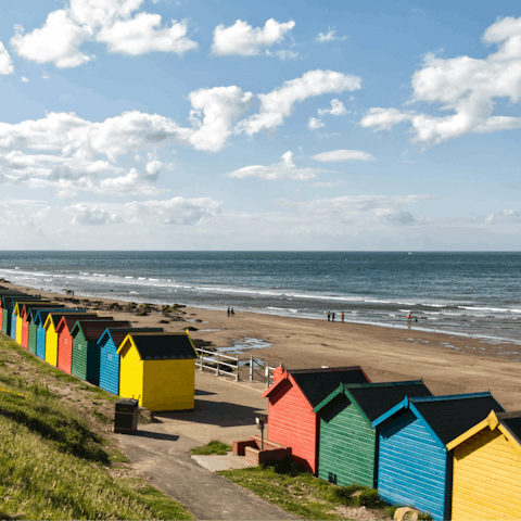 Relax on the sands of Whitby Beach, a four-minute walk away