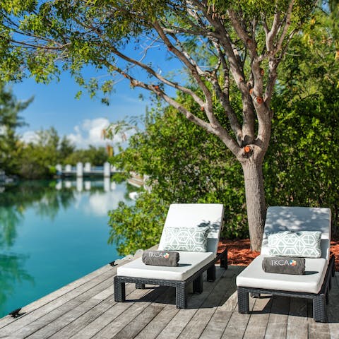 Relax on a sun lounger by the gorgeous Ailla Canal and watch the boats sail to and fro