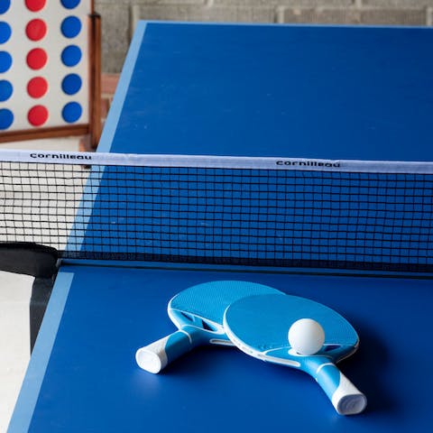 Challenge someone to a game of table tennis after a day on the beach