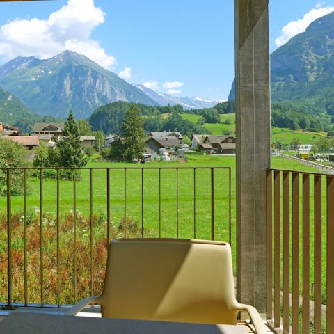 Admire the stunning mountain views from the balcony