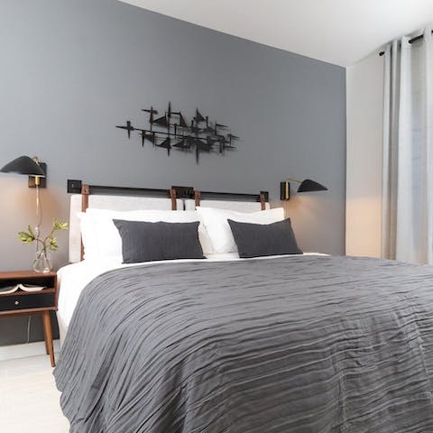 Get a peaceful night's sleep in the comfortable bedroom with its calming neutral palette