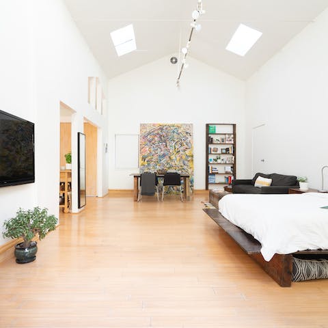 Enjoy the feeling of space thanks to the sky-high ceilings that make this garden guesthouse feel like a warehouse loft conversion