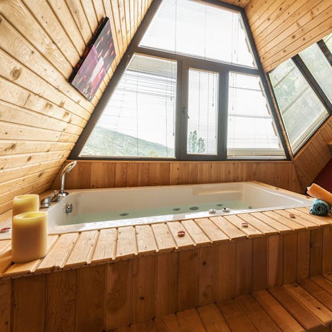 Soak in the main bedroom's jetted tub illuminated by sunlight