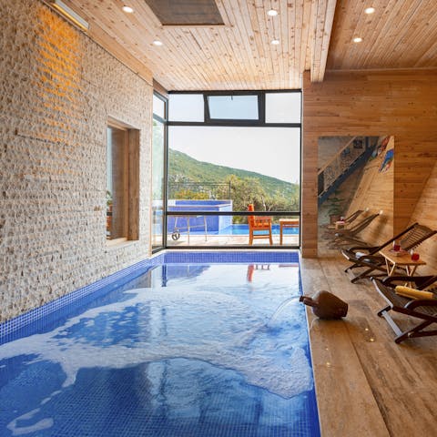 Indulge in a spa-like experience by the indoor swimming pool