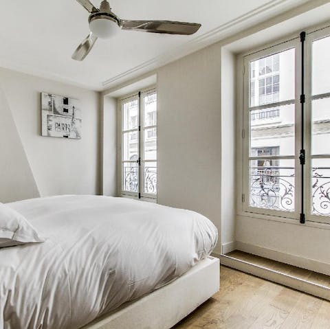 Wake up in the comfortable bedroom and open up the French doors for Juliet balcony views of  your quiet street