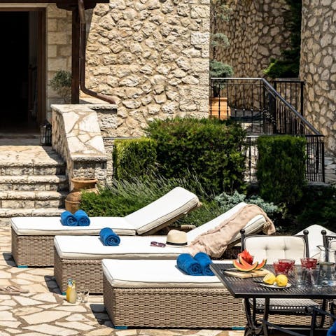 Enjoy lazy afternoons on the poolside loungers after mornings spent beach hopping