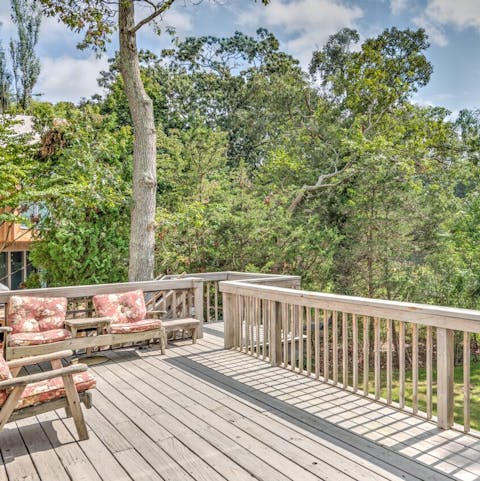Enjoy the lush green views from your spacious raised deck