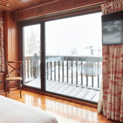 Step out onto a private balcony in the master bedroom