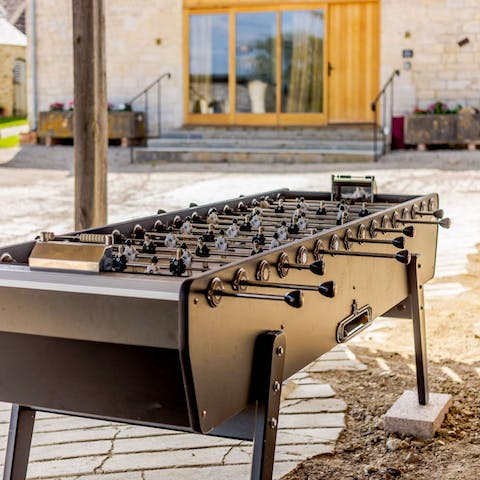 Get competitive with a game of table football or table tennis on the shared grounds