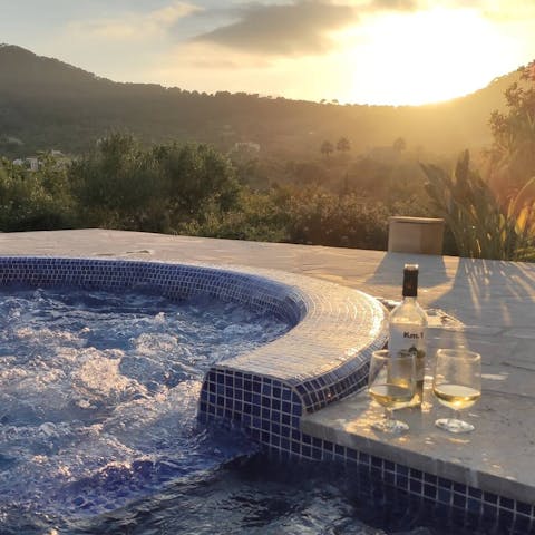 Watch nightly sunsets from your private jacuzzi