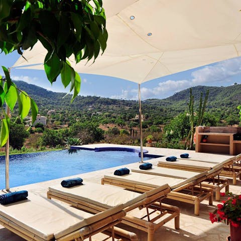 Relax by the swimming pool with far-reaching countryside views