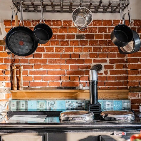 Feed your guests using the well-appointed kitchen – complete with exposed brickwork
