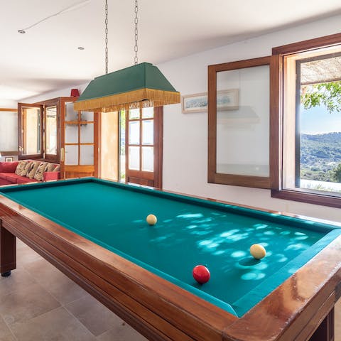 Shoot some pool while a warm Mallorcan breeze comes through the open window