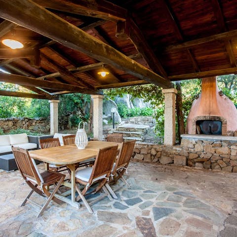 Fire up the outdoor grill and savour an alfresco feast under the pergola