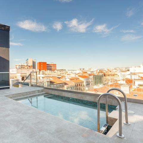 Cool off with a dip in the rooftop pool overlooking the city
