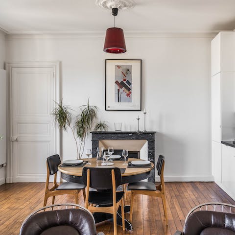 Gather your group for an elegant meal in front of the marble fireplace