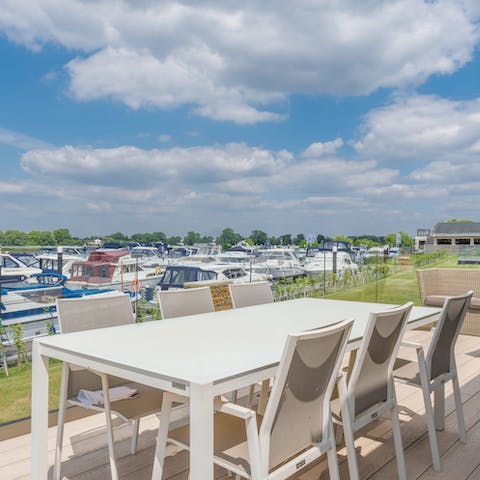 On sunny days enjoy lunch alfresco on the deck overlooking the marina