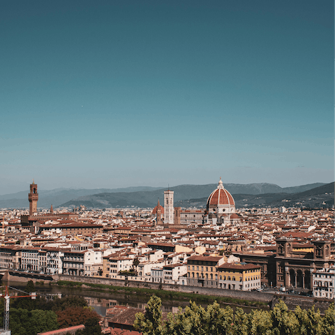 Take in the stunning views of Florence from Piazzale Michelangelo, a sixteen-minute stroll away