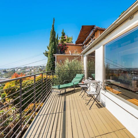 Soak up the sun on the scenic balcony – your hilltop home offers stunning views in every direction