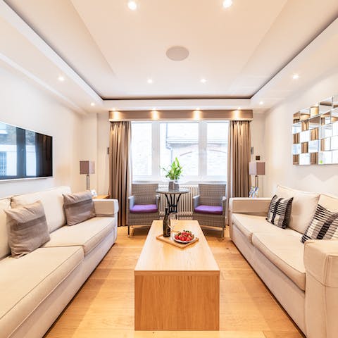 Relax in the elegant living area with a glass of wine after a busy day of London sightseeing