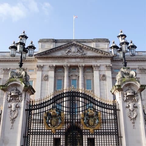 Visit iconic Buckingham Palace, a thirteen-minute stroll away