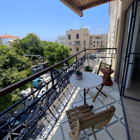 Sip a refreshing glass of arak out on the private balcony