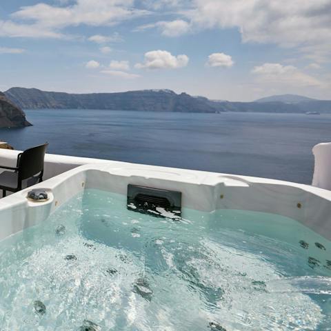Take in the caldera views from your private hot tub