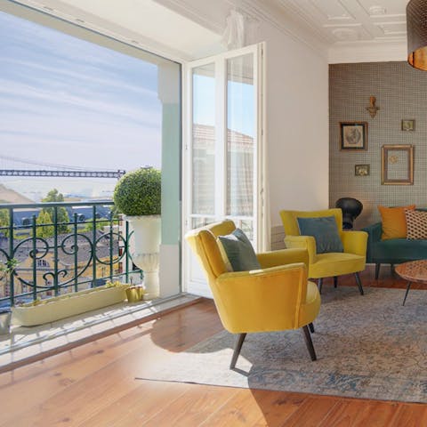 Open up the doors to the balcony and relax on a vibrant yellow armchair