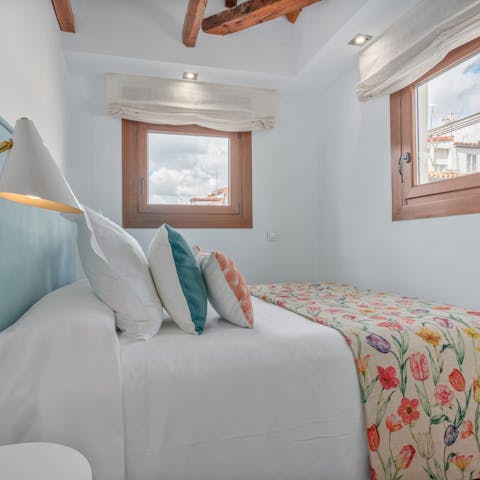 Peer out over Madrid's rooftops from the perfectly-presented bedrooms