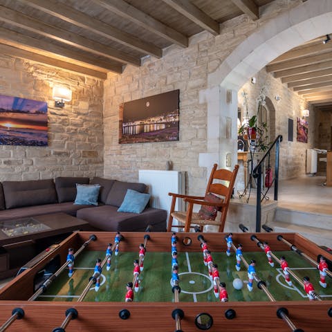 Play a few rounds of foosball in the living area