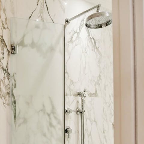 Get ready for an evening out in Florence in the stylish marble-clad bathroom