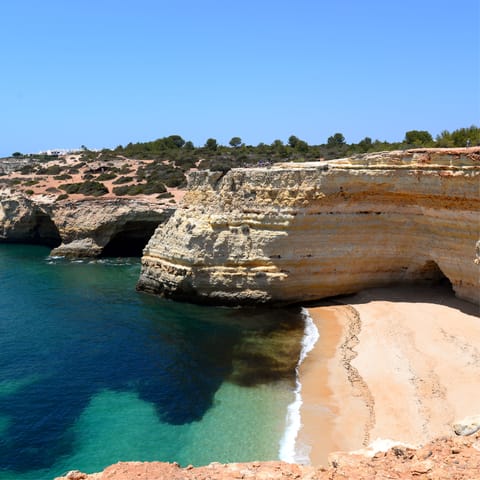 Visit the beautiful coves and beaches that are scattered along the Algarve