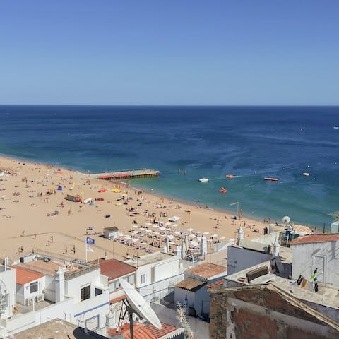 Admire views over the ocean and beach below