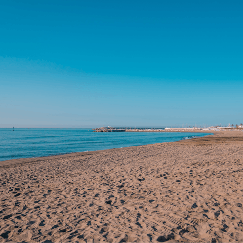 Pack your beach bag and walk down to Playa de Carvajal