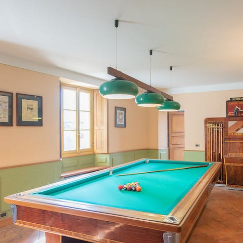 Shoot some pool in the billiards room