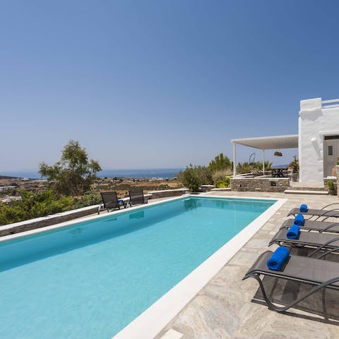 Swim in the pool and enjoy views of the Aegean Sea