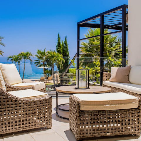 Sink into your rattan sofas on your private terrace