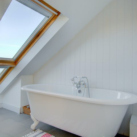 Enjoy views of the coast from the comfort of your bath