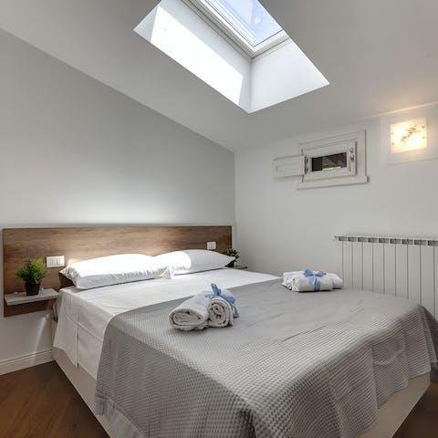 Fall asleep under the glow of the moon in the comfortable bedrooms with their skylights