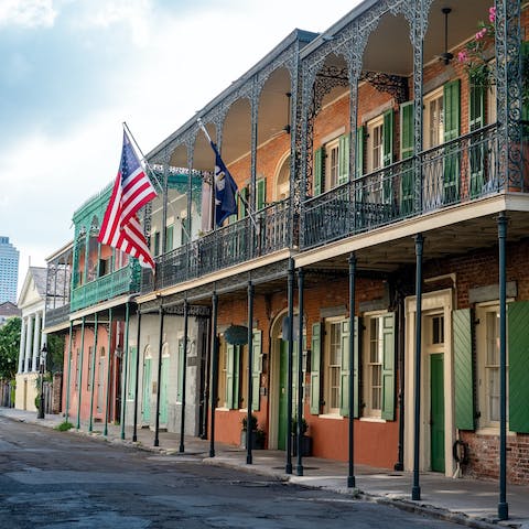 Admire the cast-iron balconies and Creole architecture in the French Quarter