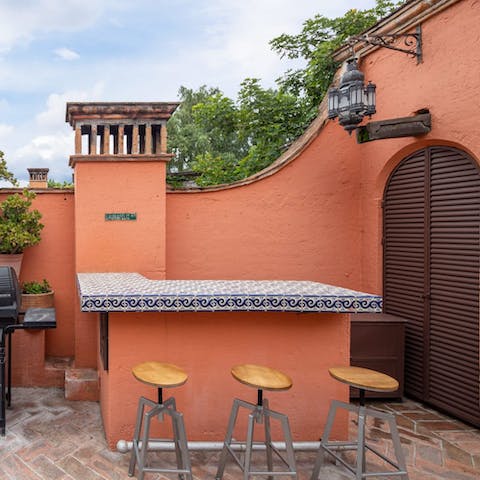 Mix up a round of margaritas at the outdoor bar