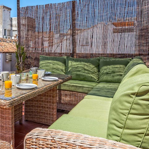 Tuck into alfresco meals on the private roof terrace