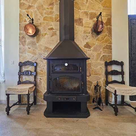 Light up the rustic fireplace once the sun goes down for the day
