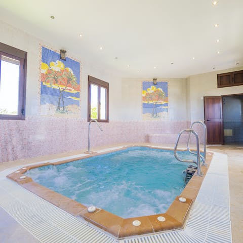 Sit back and relax in the bubbling waters of the large Jacuzzi