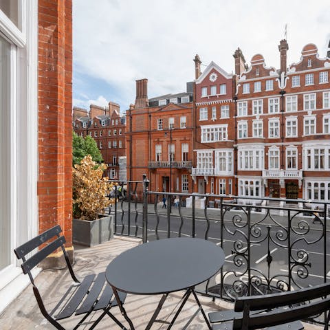 Enjoy a glass of fizz on the street-facing balcony