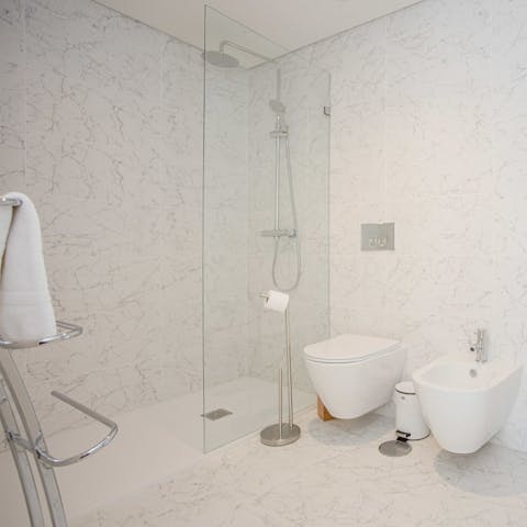 Start mornings with a relaxing soak under the bathroom's rainfall shower